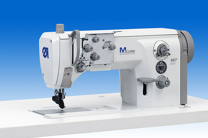 Single needle lockstitch flat bed machine with wheel feed